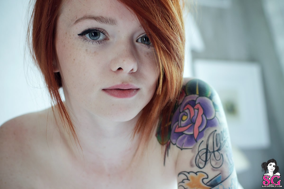 Naked redhead tattoo girl