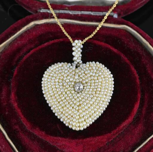 A rare find, this wonderfully crafted antique Georgian pendant has woven natural seed pearls into a heart shape with a sparkling center diamond. All this handwork is done pearl by pearl, which makes it more the treasure! Very hard to find woven pearl jewelry retaining all the pearls and threading secure.
Find this beautiful exquisite piece and more like it by clicking the link below

https://boylerpf.com/products/antique-georgian-seed-pearl-diamond-heart-pendant