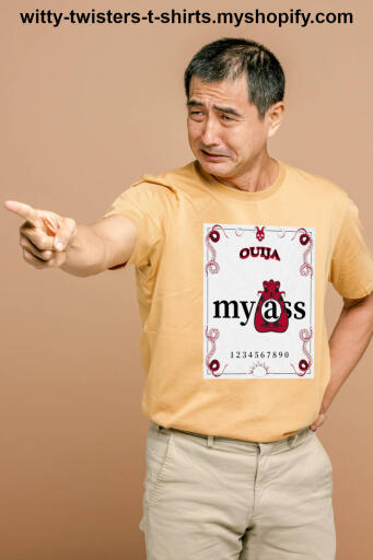 The ouija, also known as a spirit board or talking board, is a flat board marked with the letters of the Latin alphabet, the numbers 0–9, and the words "yes", and "no". It uses a planchette to spell out messages during a séance. On this funny ghost movies parody t-shirt, it says; Ouija My Ass. Whether you believe in supernatural spirits or not, if you do Ouija something, it just might be your ass.

Buy this funny ghost movie Ouija séance t-shirt here:

https://witty-twisters-t-shirts.myshopify.com/products/ouija-my-ass