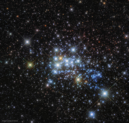 Star cluster Westerlund 1 is home to some of the largest and most massive stars known. It is headlined by the star Westerlund 1-26, a red supergiant star so big that if placed in the center of our Solar System, it would extend out past the orbit of Jupiter. Additionally, the young star cluster is home to 3 other red supergiants, 6 yellow hypergiant stars, 24 Wolf-Rayet stars, and several even-more unusual stars that continue to be studied. Westerlund 1 is relatively close-by for a star cluster at a distance of 15,000 light years, giving astronomers a good laboratory to study the development of massive stars. The featured image of Westerlund 1 was taken by the Hubble Space Telescope toward the southern constellation of the Altar (Ara). Although presently classified as a "super" open cluster, Westerlund 1 may evolve into a low mass globular cluster over the next billion years. Image Credit: ESA/Hubble & NASA