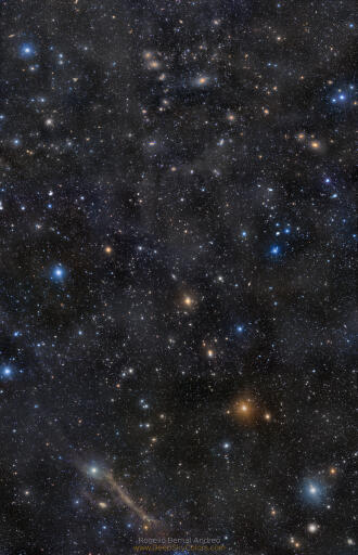 Top to bottom, this colorful and broad telescopic mosaic links Markarian's Chain of galaxies across the core of the Virgo Cluster to dusty spiral galaxy Messier 64. Galaxies are scattered through the field of view that spans some 20 full moons across a gorgeous night sky. The cosmic frame is also filled with foreground stars from constellations Virgo and the well-groomed Coma Berenices, and faint, dusty nebulae drifting above the plane of the Milky Way. Look carefully for Markarian's eyes. The famous pair of interacting galaxies is near the top, not far from M87, the Virgo cluster's giant elliptical galaxy. At the bottom, you can stare down Messier 64, also known as the Black Eye Galaxy. The Virgo Cluster is the closest large galaxy cluster to our own local galaxy group. Virgo Cluster galaxies are about 50 million light-years distant, but M64 lies a mere 17 million light-years away.  Image Credit & Copyright: Rogelio Bernal Andreo (Deep Sky Colors)