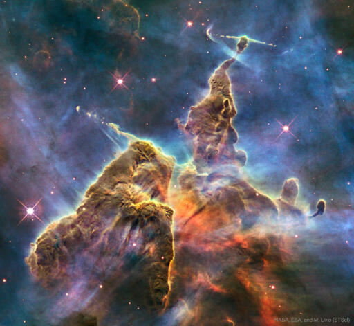 It's stars versus dust in the Carina Nebula and the stars are winning. More precisely, the energetic light and winds from massive newly formed stars are evaporating and dispersing the dusty stellar nurseries in which they formed. Located in the Carina Nebula and known informally as Mystic Mountain, these pillar's appearance is dominated by the dark dust even though it is composed mostly of clear hydrogen gas. Dust pillars such as these are actually much thinner than air and only appear as mountains due to relatively small amounts of opaque interstellar dust. About 7,500 light-years distant, the featured image was taken with the Hubble Space Telescope and highlights an interior region of Carina which spans about three light years. Within a few million years, the stars will likely win out completely and the entire dust mountain will evaporate. Image Credit: NASA, ESA, and M. Livio (STScI).